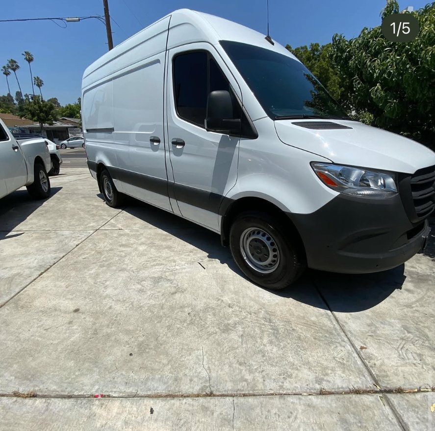 White Sprinter van